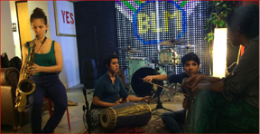 Rajna Swaminathan playing Mrudangam with her accompanists