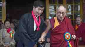 Tibetan spiritual leader the Dalai Lama, right, smiles as he poses for a photograph with Lobsang Sangay, who was sworn in as Prime Minister of the Tibetan government-in-exile for the second five-year term in Dharmsala, India, Friday, May 27, 2016. Sangay was the first elected Tibetan political leader after the Dalai Lama dissolved his powers in 2011. (AP Photo/ Ashwini Bhatia)