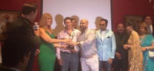 Ashtar Sayed (Director) and Michael Pellico (Writer and Executive Producer) receiving the award on behalf of Raveena Tandon at Festival of Globe Silicon Valley (FOGSV)