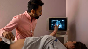 Dr. Bhavik Kumar, 31, of Austin, Texas, listens to a question from a patient considering abortion during her ultrasound at the Whole Woman's Health clinic in Fort Worth, Texas