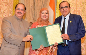 Dr.Gopal Lalmalani, Mayor of Oak Brook handing over a Proclamation of Oak Brook to Dr. Sayeed and Ms. Farha Sayeed for their services to the community