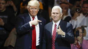 President-elect Donald Trump, left, and Vice President-elect Mike Pence acknowledge the crowd during the first stop of his post-election tour, Thursday, Dec. 1, 2016, in Cincinnati. (AP Photo/John Minchillo)