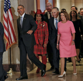 President Barack Obama waves as he arrives on U.S. Capitol Hill in Washington, to meet with House and Senate Democratic leaders. Walking with him is Rep. Federica Wilson, D-Fla., Rep. Joseph Crowley, D-NY., Senate Minority Leader Charles Schumer of N.Y., and House Minority Leader Nancy Pelosi of Calif. Obama was at the Capitol to give congressional Democrats advice on how to combat the Republican drive to dismantle his health care overhaul.