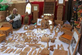 Master craftsman Mahesh Chand Sharma with his unique wood carvings