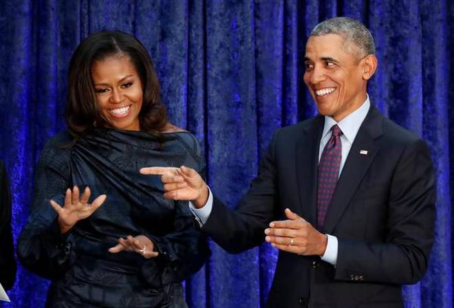 Barack and Michelle Obama sign production deal with