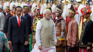 Prime Minister Narendra Modi reviews guard of honour accompanied by Indonesia President Joko Widodo