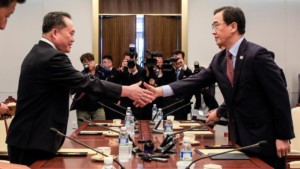 South Korean Unification Minister Cho Myoung gyon right shakes hands with the head of North Korean delegation Ri Son Gwon