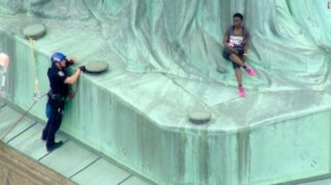 Protesters Climb Shuts Down Statue of Liberty