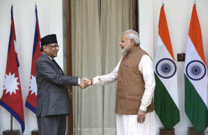 Indian Prime Minister Narendra Modi right shakes hand with his Nepali counterpart Pushpa Kamal Dahal