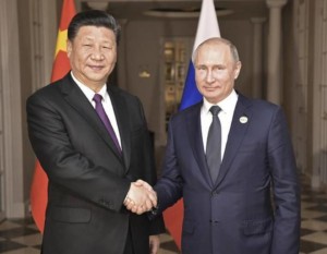 Chinas President Xi Jinping left poses with Russias President Vladimir Putin