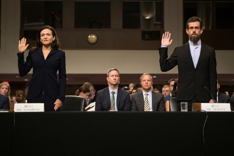 Twitter CEO Jack Dorsey R and Facebook chief operating officer Sheryl Sandberg