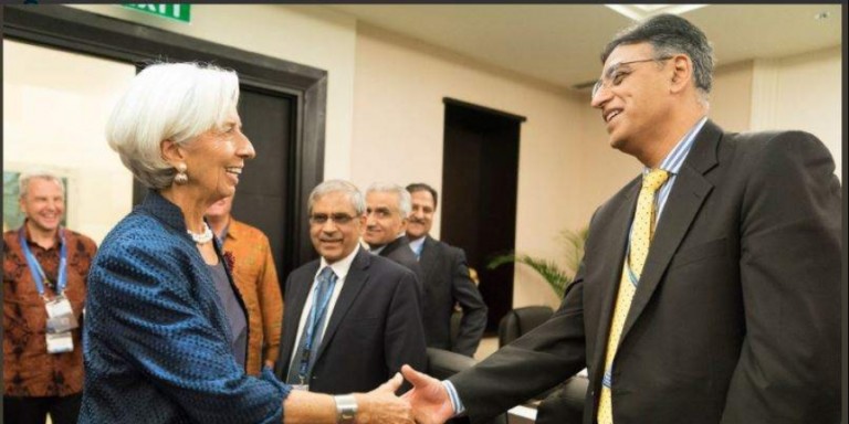 IMF chief Christine Lagarde shankes hand with Pakistan Finance Minister Asad Umar