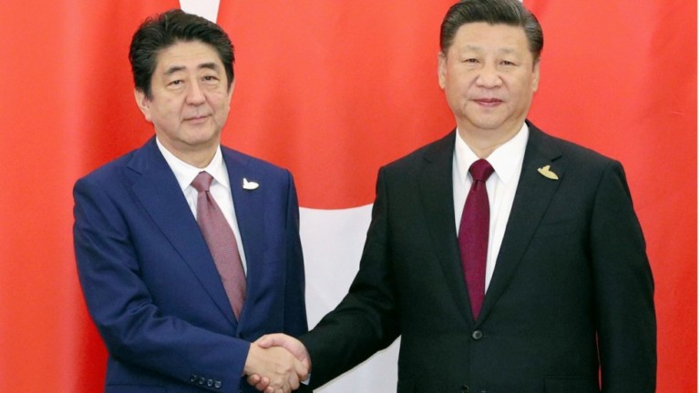 Japan China strike deals during Abe visit as ties improve