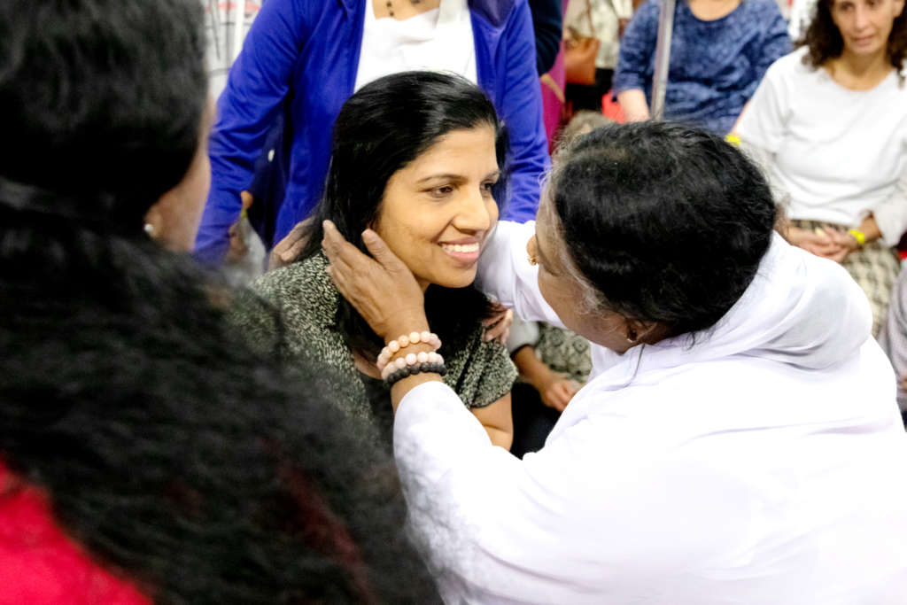 Amma giving hug and blessings