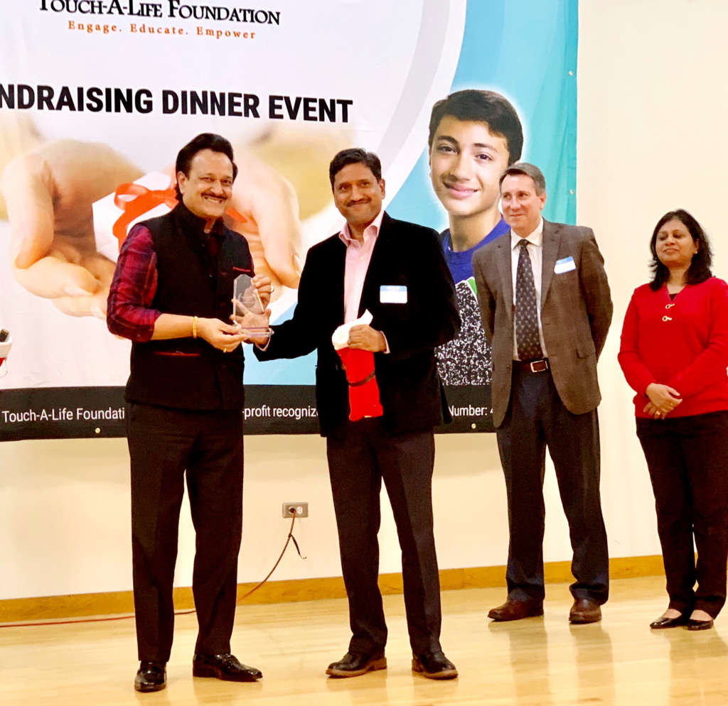 Dr Romesh Japra receiving Touch A Life Hero Award