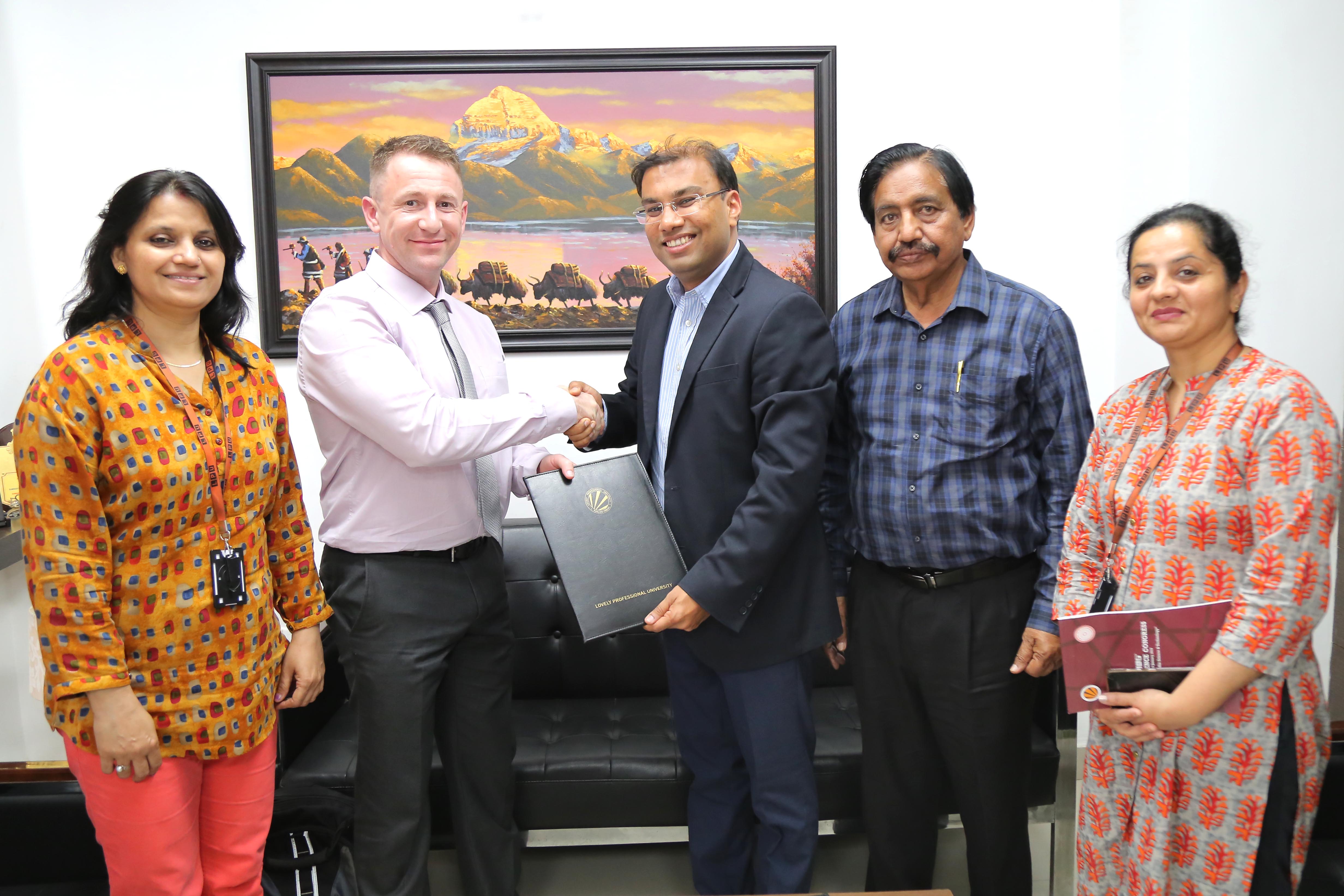 Prof Simon Dawson and LPU Director Mr Aman Mittal expressing happiness after signing of MoU at LPU Campus