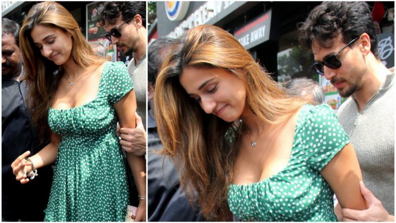 Actor Tiger Shroff protected actress Disha Patani from getting mobbed by fans while leaving a restaurant here.