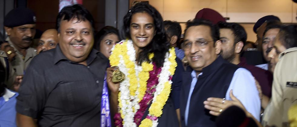 World champion Sindhu returns to hero's welcome, says feeling yet to sink in
