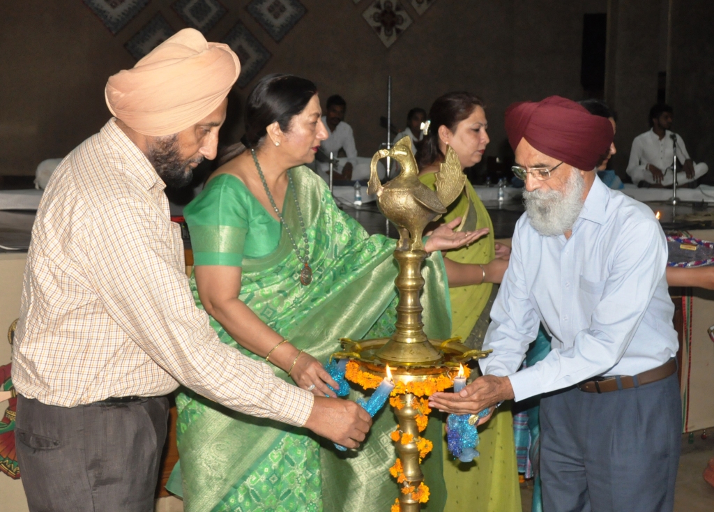 Punjab Kala Parishad Chairman and eminent litterateur Surjit Patar, KMV College principal Dr Atima Sharma Diwedi and noted journalist Dr Lakhwinder Singh Johal lighting the ceremonial lamp at a function held in connection with the upcoming 550th birth anniversary of Guru Nanak Dev