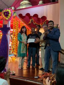 Anirban Acharya (second from left) receiving a certificate of recognition from the city of Fremont Mayor Lily Mei (left) at Fremont Hindu Temple. To his right are: Deepak Chhabra, Mahesh Pakala (in the back) and Judhajit Senmazumdar (far right).