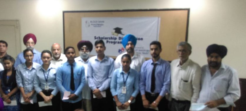 A group of recipients of scholarships given by S. Charanjit Singh Bassi Memorial Charitable Trust is seen with K.K. Sardana, MD, Sukhjit Starch and Chemicals Limited Phagwara and eminent educationist, Malkiat Singh Ragbotra, president , Blood Donors Council , Jaswant Singh Gandam, the trust’s secretary, Amarjit Singh, its cashier, Gurmit Palahi, council member, and Inderpal Singh, Principal, Arya IMT, Phagwara