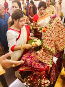 Women worshipping during Durga Puja