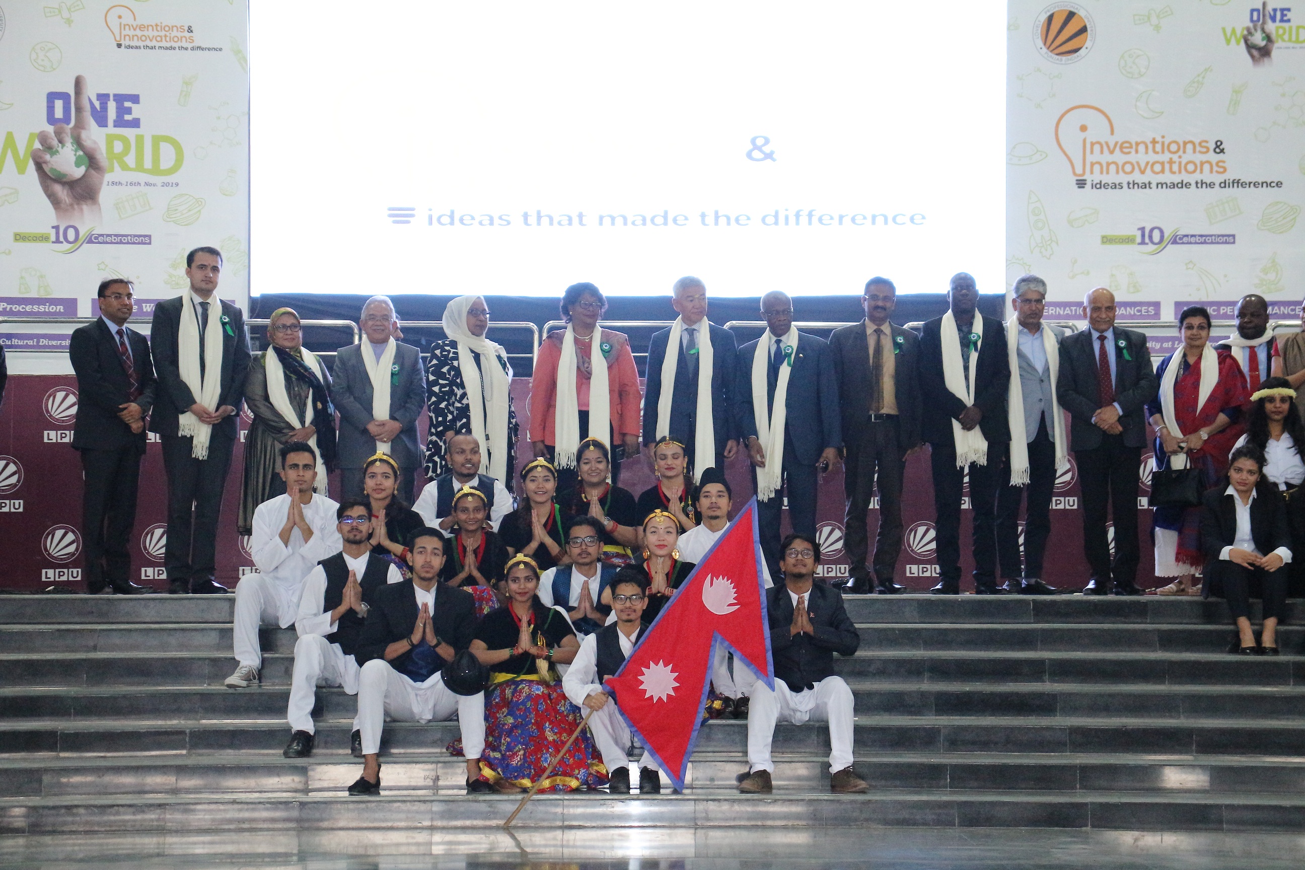 LPU Chancellor Mr Ashok Mittal standing along Ambassadors and Diplomats from six Nations during an annual ONE WORLD fest at LPU campus