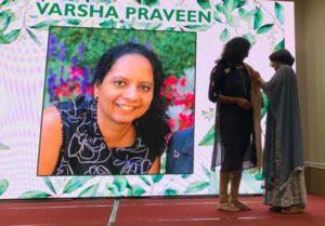 Volunteer Varsha Praveen being felicitated
