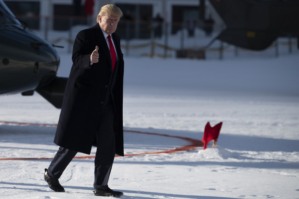 Trump arrives in Davos hours before impeachment trial reopens