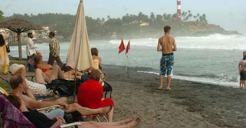 Foreign tourists break lockdown norms, go for swim at Kovalam