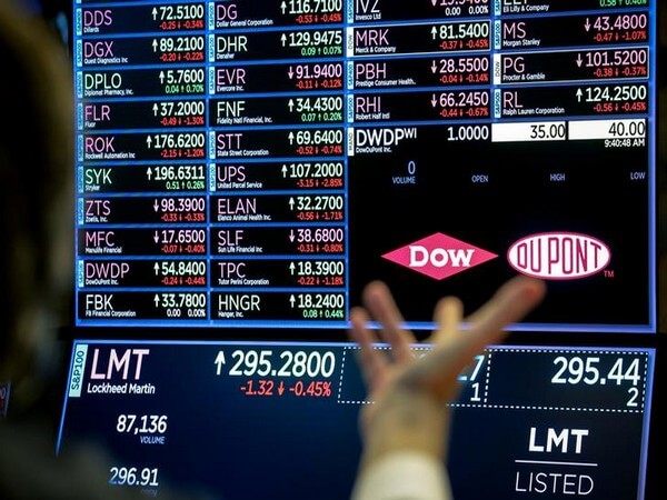 A screen displays the trading information for chemical producer DowDuPont Inc. on the floor at the NYSE in New York