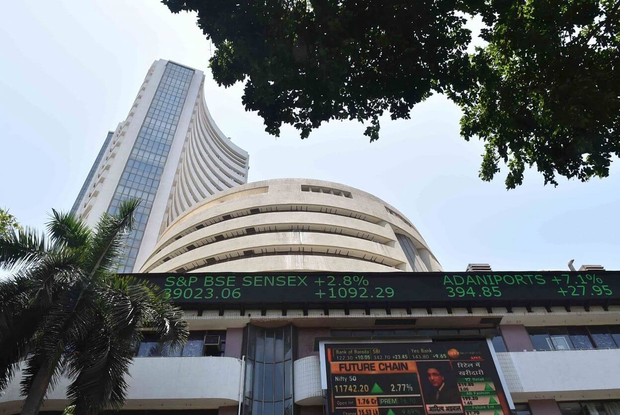 Sensex surges 600 points to claim new highs