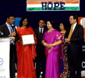 Dr. Santosh Kumar awarding AAPI – Dr. Suresh Reddy and Dr. Meher Madhavaram, In Recognition of its extraordinary efforts to serve the people of India during this Pandemic time