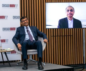 Dean of Chicago Booth School of Business and George Pratt Shultz Professor of Accounting Madhav Rajan welcomes the in-person and virtual audience to the school’s Future of Capitalism event at the school’s new London Campus