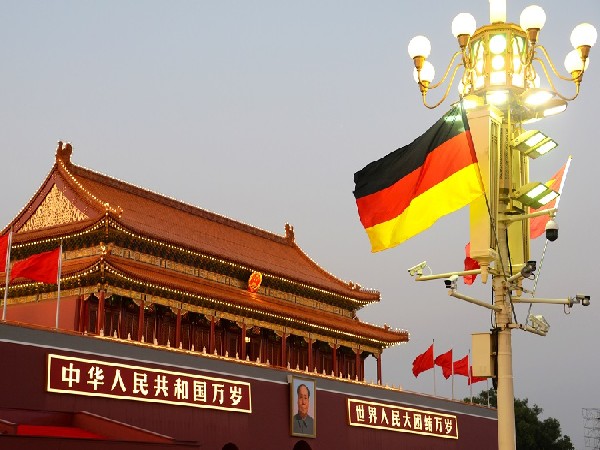 Chinese and German flags flutter in front of Tiananmen Gate as Germany Chancellor Angela Merkel visits China, in Beijing