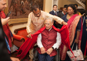 Governor Abbott presented a shawl by one of his guests