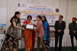 Winners of poetry competition receiving award