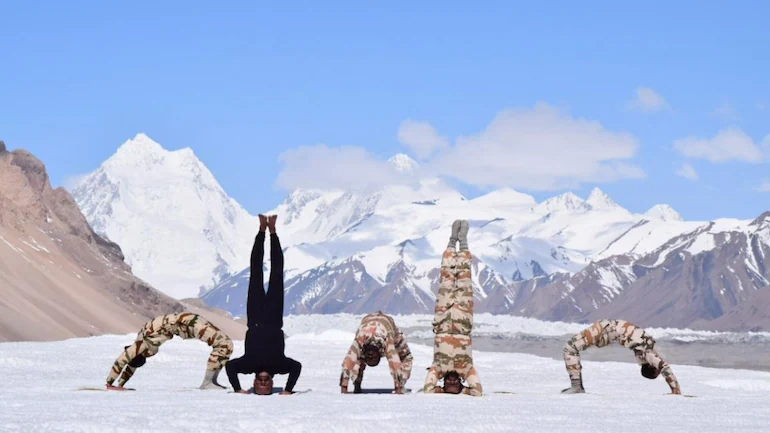 Himveers of ITBP practice yoga at high altitudes in the Himalayas