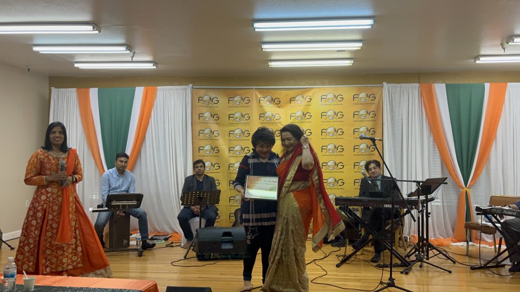 Alka Bhatnagar (right) receiving a Certificate of Appreciation from Daisy Chu