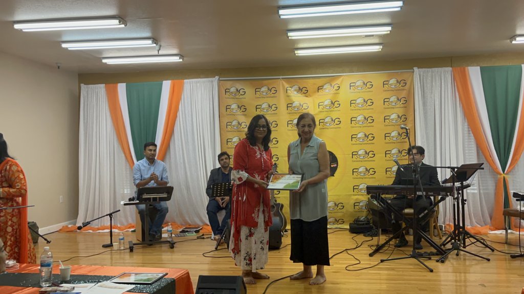 Niharika Srivastav (right) receiving a Certificate of Appreciation from senior FOG member, Shikha Trikha