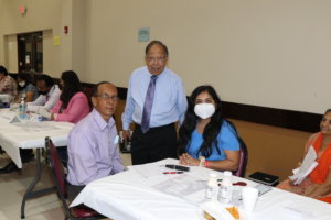. Volunteer Mukund Thakkar, Dipak Desai and Satish Patel helping patients with registration
