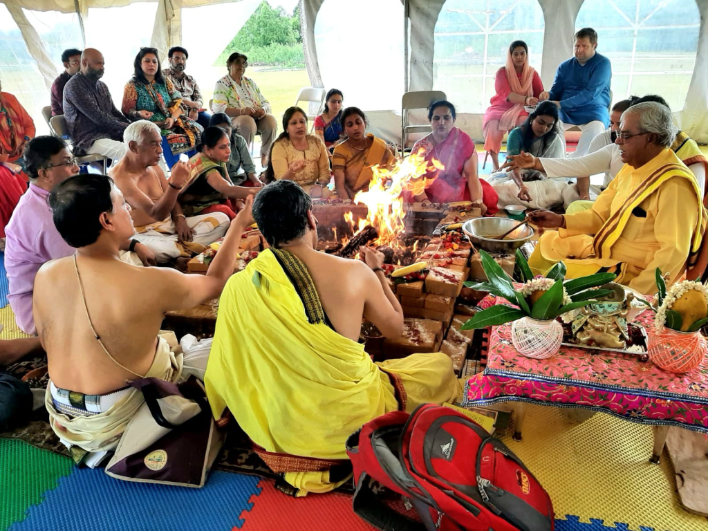 Hindu Temple priests and sponsors performing Homam