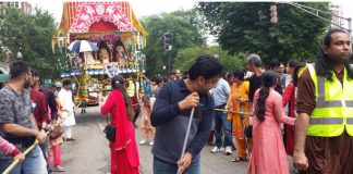 ISCKON Devotees sweeping the road for the chariot to move on