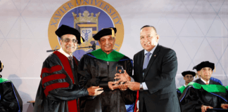 Life time achievement award being conferred by Hon Minister of Aruba Mr.Croes along with the President of Xavier University of School of Medicine Mr. Ravi Bhopalapu