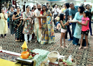 Devotees performing Arati to Lord Krishna (1)