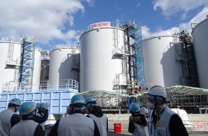In this file photo, officials at Tokyo Electric Power Co., the operator of the crippled Fukushima nuclear plant, speak to journalists at Fukushima Daiichi Nuclear Power Station on Feb. 2, 2023.(Yonhap/IANS)