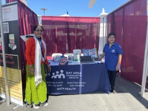  Lakshmi Iyer with volunteer at Bay Area Community Health Booth