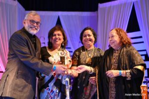 Dr. Umang Patel receiving the Pramod Kumar Philanthropy Award
