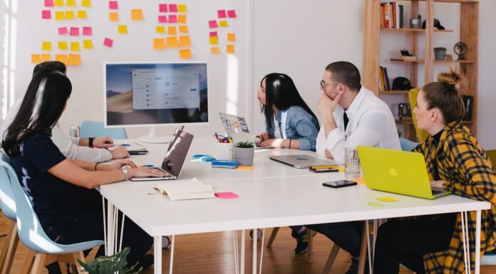 A team in an office discussing account planning during a meeting