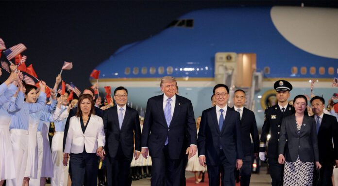 President Trump arrives in China for high-stakes summit with President Xi Jingping Trump